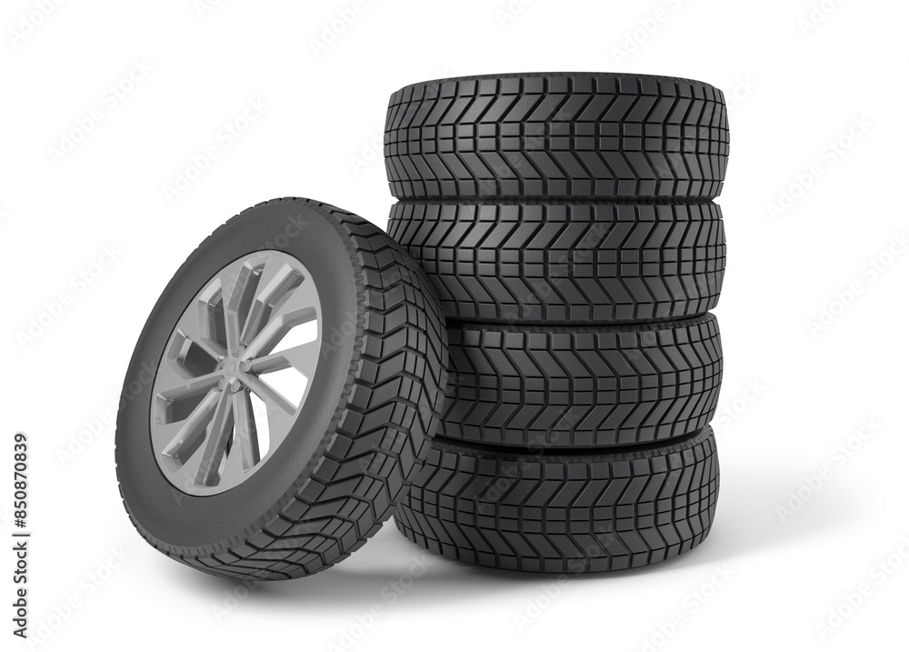 A stack of vehicle wheels and tires isolated from the white background A stack of vehicle wheels and tires isolated from the white background