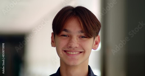 A happy smile of a handsome male high school student who is half Asian-European.