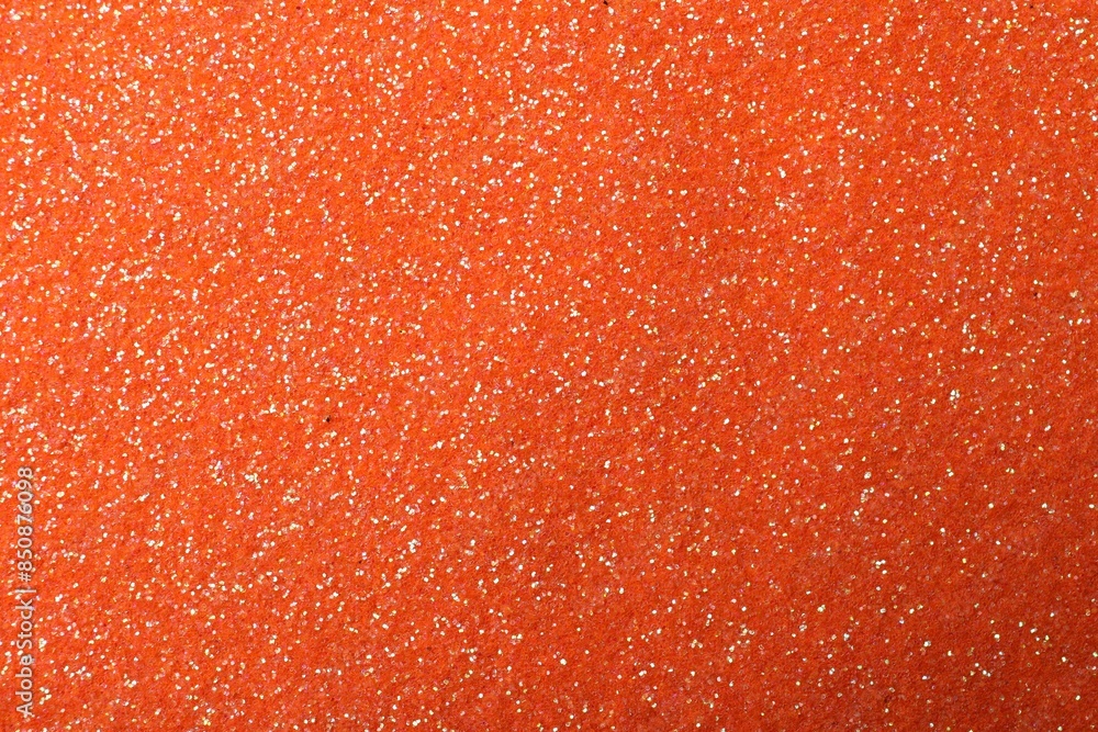 Beautiful shiny orange glitter as background, closeup Beautiful shiny orange glitter as background, closeup