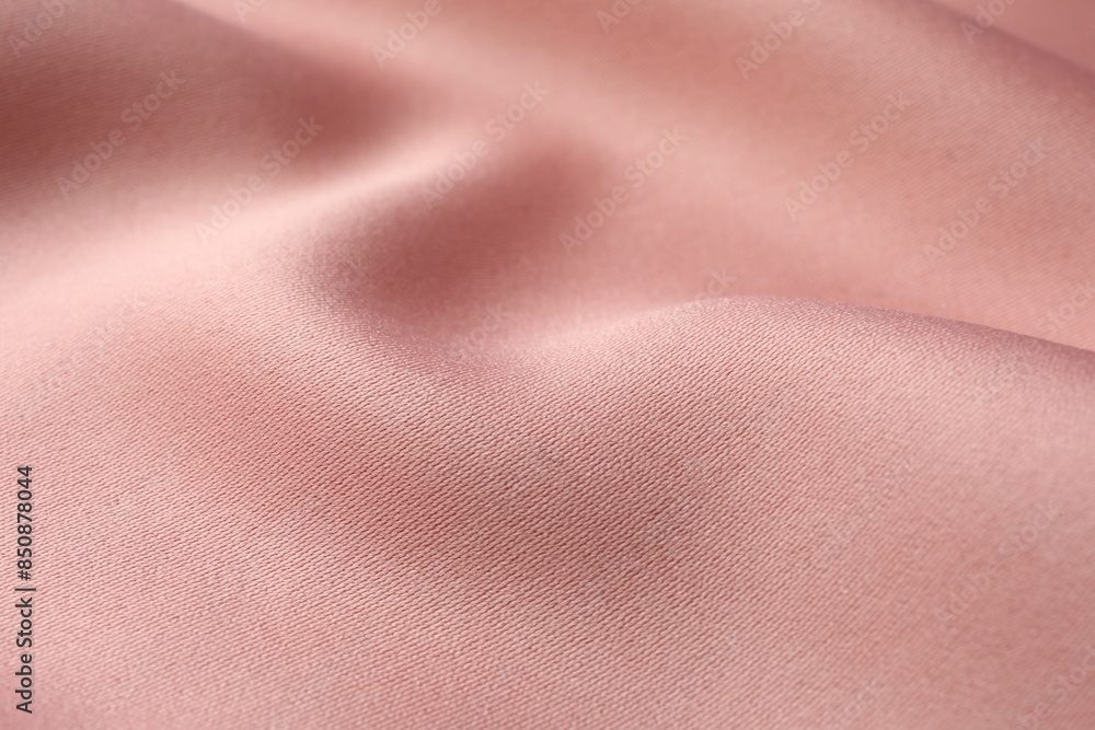 Fototapeta premium Texture of pink silk fabric as background, closeup