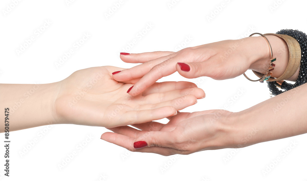 Fortune teller reading lines on woman's palm against white background. Chiromancy Fortune teller reading lines on woman's palm against white background. Chiromancy