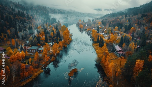 Aerial View of a Winding River Through a Foggy Forest in Autumn
