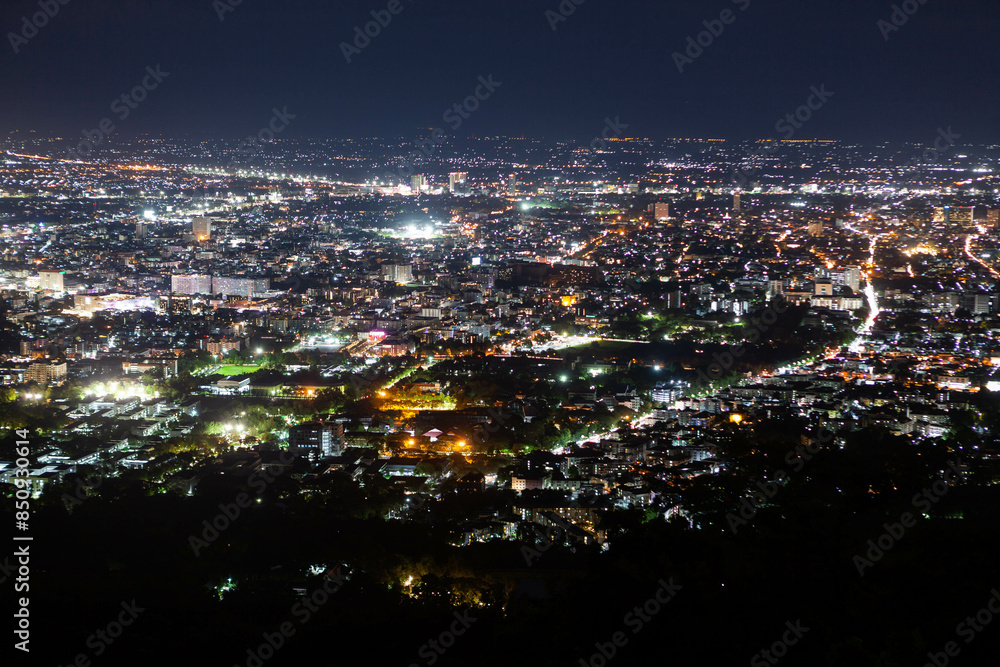 Night Chiang Mai view. Illuminated city view at night from the viewpoint on the way to Doi Suthep temple. Night Chiang Mai view. Illuminated city view at night from the viewpoint on the way to Doi Suthep temple.