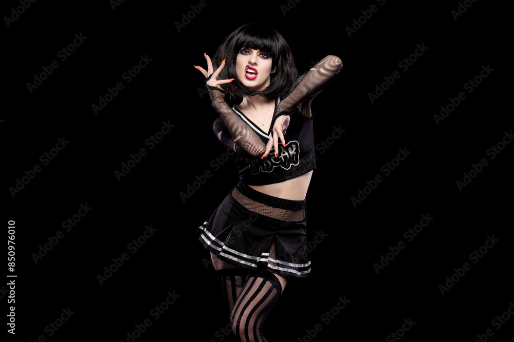 Portrait of beautiful goth punk model in studio on black background Portrait of beautiful goth punk model in studio on black background