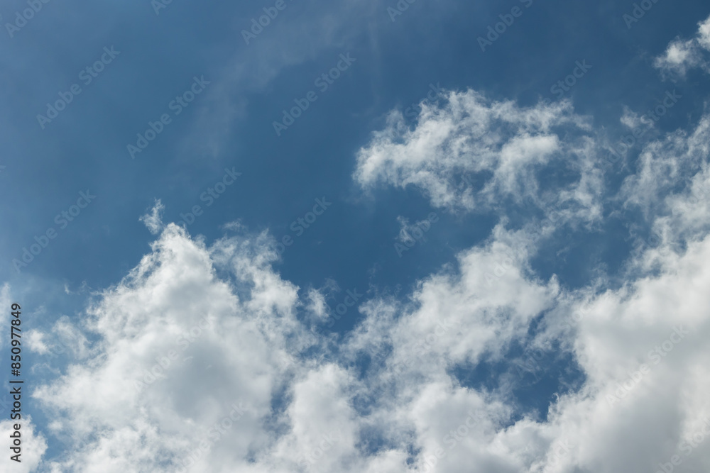White clouds on a bright blue sky White clouds on a bright blue sky