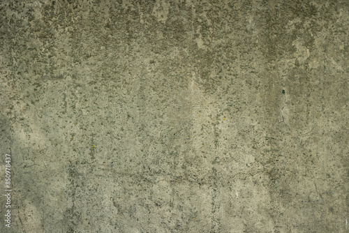 Gray concrete wall with rough texture and dirt on it