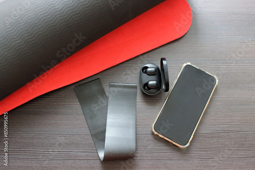 accessories for sports: mat, elastic band, phone, headphones