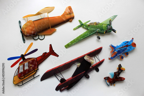 children's background: colorful airplanes on white
