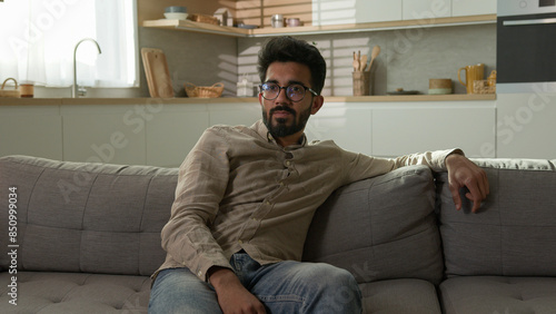 Obraz na plátně Bored unhappy tired Arabian Indian man millennial ethnic guy exhausted male home