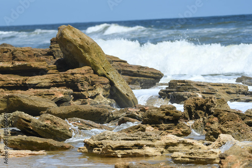 Waves crashing over coquina rocks on Florida's Palm Coast.