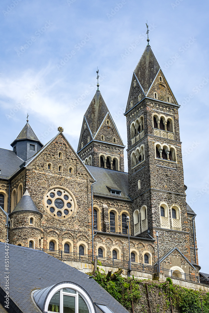 View of Saints Cosmas and Damian Church (Eglise Saints-Come-et-Damien) with two spires. Clervaux, Luxembourg. View of Saints Cosmas and Damian Church (Eglise Saints-Come-et-Damien) with two spires. Clervaux, Luxembourg.