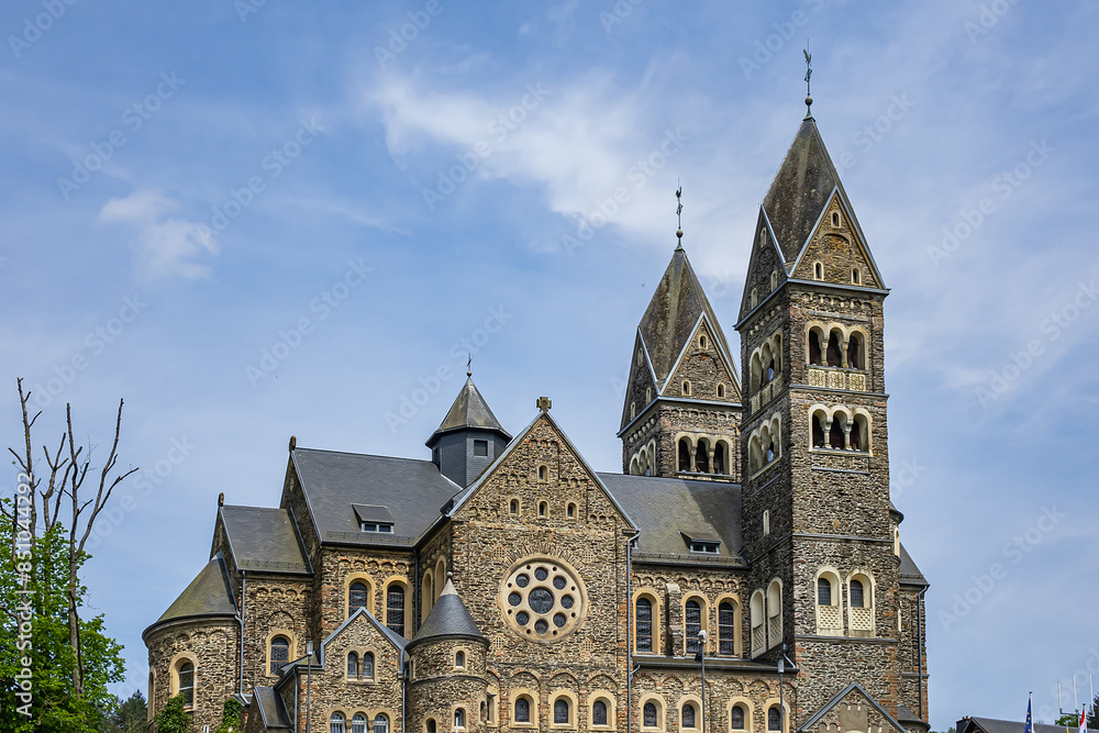 View of Saints Cosmas and Damian Church (Eglise Saints-Come-et-Damien) with two spires. Clervaux, Luxembourg. View of Saints Cosmas and Damian Church (Eglise Saints-Come-et-Damien) with two spires. Clervaux, Luxembourg.