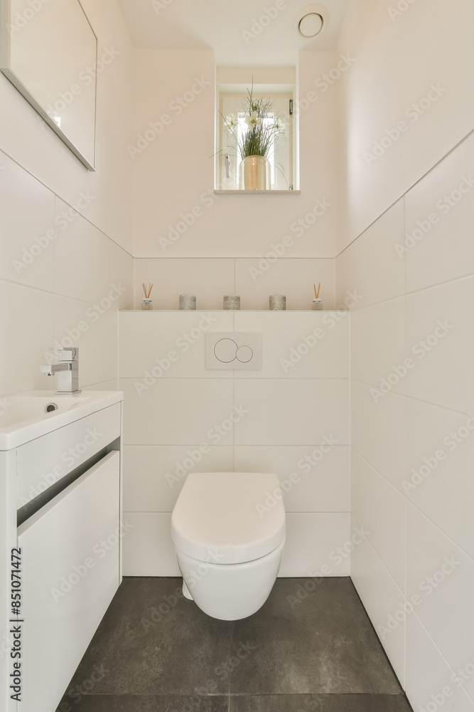 Modern Minimalist Bathroom with Wall-Mounted Toilet and Small Sink Modern Minimalist Bathroom with Wall-Mounted Toilet and Small Sink
