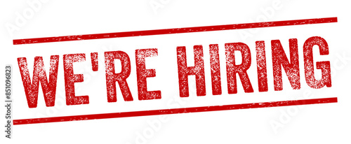 We're Hiring Red Watermark Stamp isolated on transparent background. Text caption between parallel lines with grunge design style.