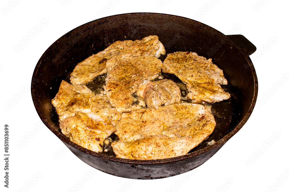 Fried meat in a frying pan.Roast pork in a frying pan on a white background.Pieces of fried meat. Fried meat in a frying pan.Roast pork in a frying pan on a white background.Pieces of fried meat.
