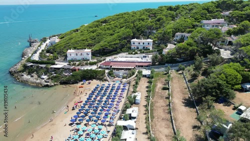 borgo marinaro sulla costa del gargano con una spiaggia attrezzata visto dall'alto photo