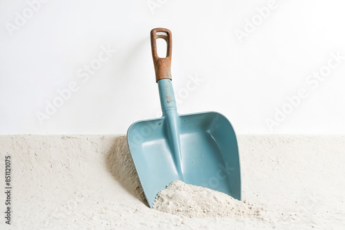 Blue Shovel in White Sand