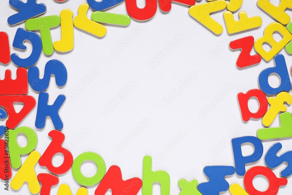 Alphabet. Many colorful magnetic letters isolated on white, top view