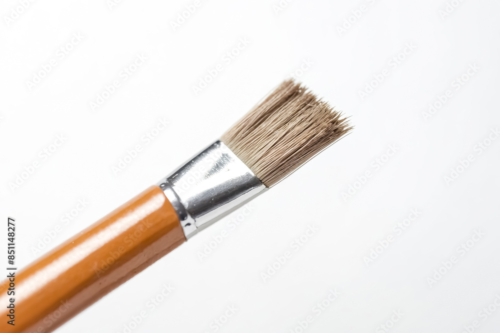 Close up of a paintbrush on a white background Close up of a paintbrush on a white background