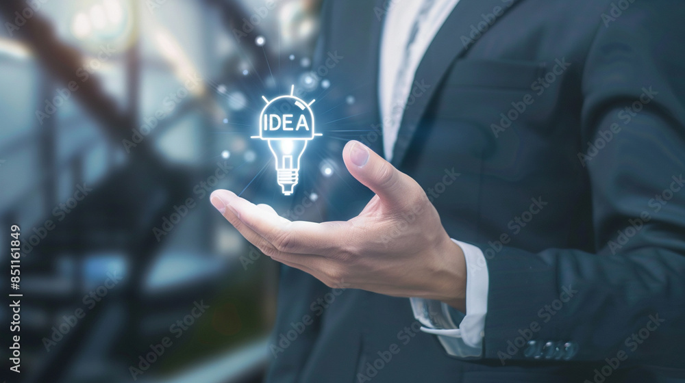Fototapeta premium Illuminated Light Bulb with 'Idea' Inside - Conceptual Creativity and Innovation