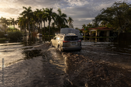 These images show the 2024 Hallandale Beach flood aftermath. Residential streets and cars are submerged, reflecting the severe impact of flooding on communities and highlighting the need for recovery 