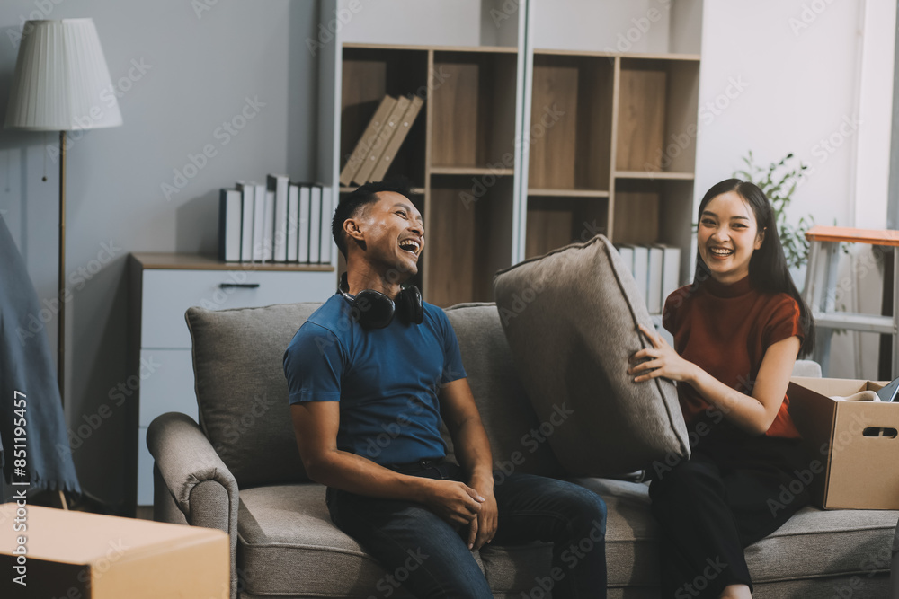 Young Happy Attractive Asian Couple Teasing Each Other With Pillow young-happy-attractive-asian-couple-teasing-each-other-with-pillow