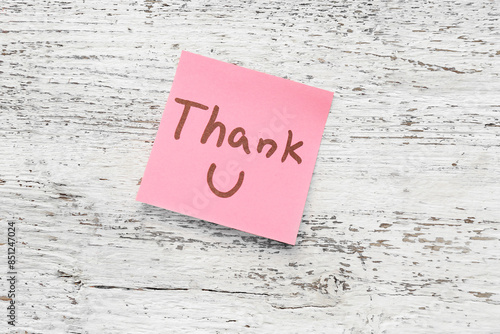 Sticky note with text THANK...