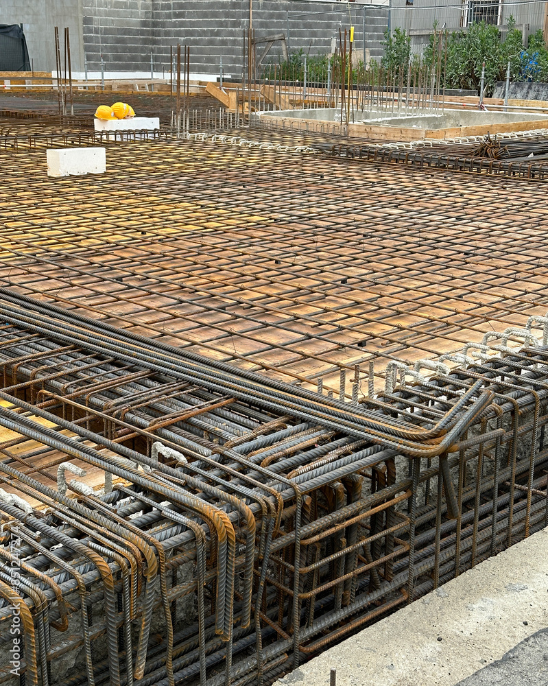 Obraz premium Metal construction material at the foundation of a new building
