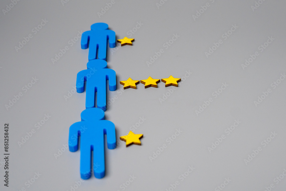 Human figure and yellow stars with copy space. Performance appraisal, rating and feedback concept. Human figure and yellow stars with copy space. Performance appraisal, rating and feedback concept.