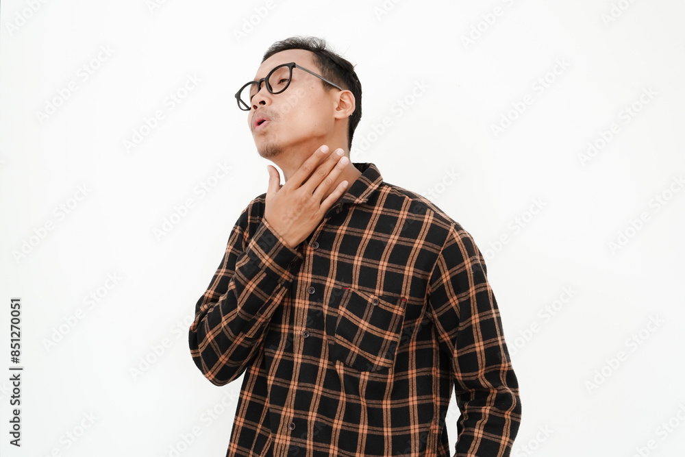 a young man wearing a flannel shirt, wearing glasses is thirsty (dry throat) on a plain white background