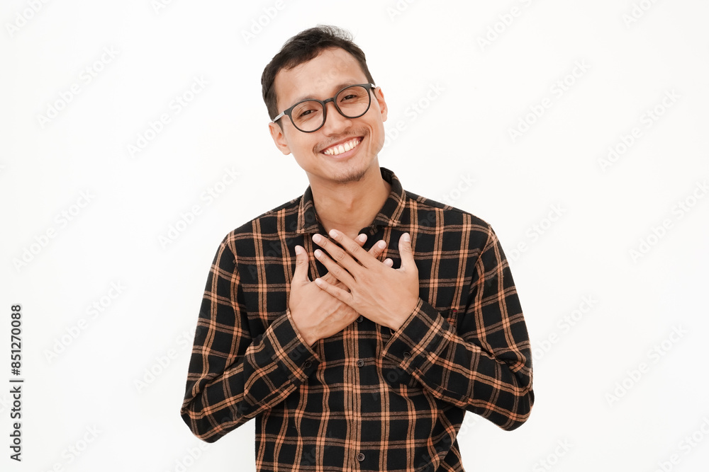 a young man wearing a flannel shirt, wearing glasses with an expression of gratitude, raising both hands (praying). With a plain white background a young man wearing a flannel shirt, wearing glasses with an expression of gratitude, raising both hands (praying). With a plain white background