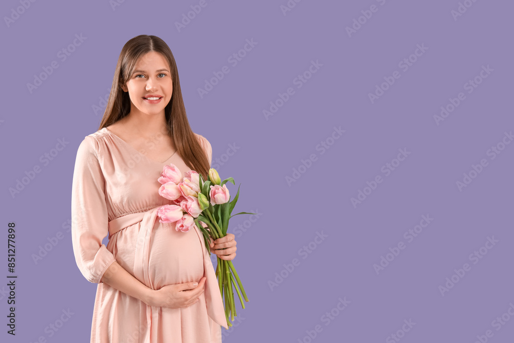 Young pregnant woman with tulips on lilac background Young pregnant woman with tulips on lilac background
