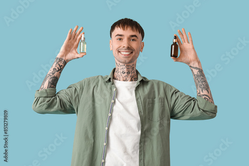 Young tattooed man with bot...