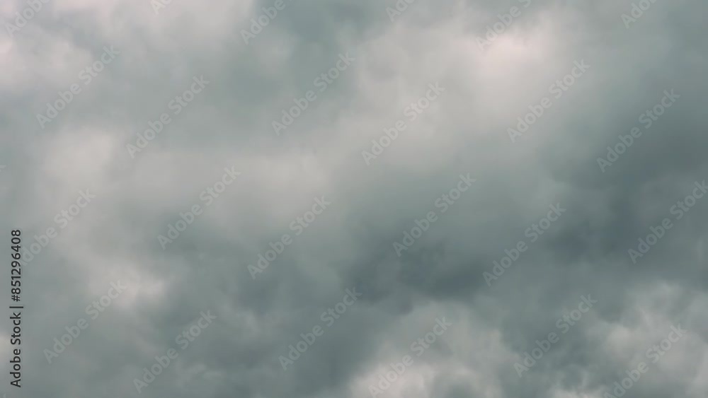 Timelapse video capturing the rapid movement of dark rain clouds across the sky. The accelerated motion emphasizes the dynamic and changing weather patterns, offering a dramatic view of nature power. Timelapse video capturing the rapid movement of dark rain clouds across the sky. The accelerated motion emphasizes the dynamic and changing weather patterns, offering a dramatic view of nature power.