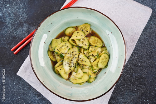 Sunomono, Japanese Cucumber Salad, sliced cucumbers with  dressing of soy sauce, rice vinegar, sesame oil and sugar photo