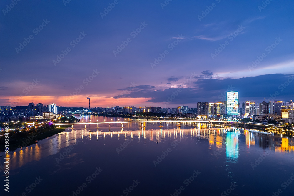 Naklejka premium Aerial photography of the night scene on both sides of the Xiangjiang River in Zhuzhou, China