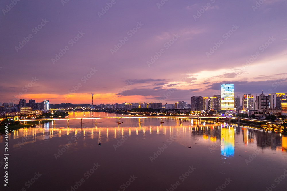 Fototapeta premium Aerial photography of the night scene on both sides of the Xiangjiang River in Zhuzhou, China