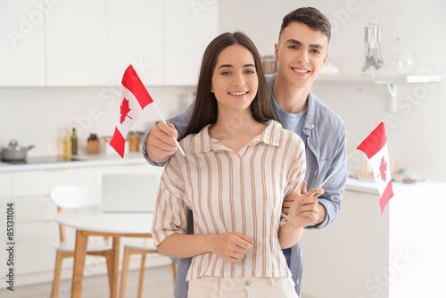 Young couple with flags of ...