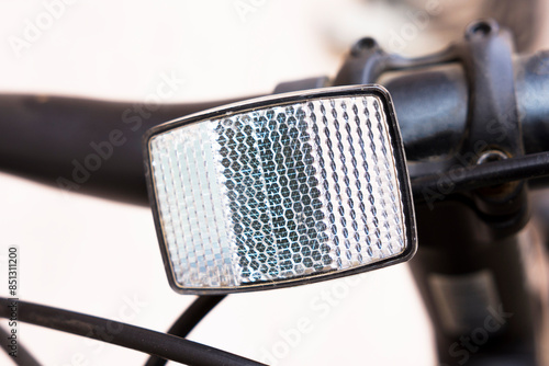 Bild auf Leinwand Close-up of the reflector on the handlebars of a bicycle.