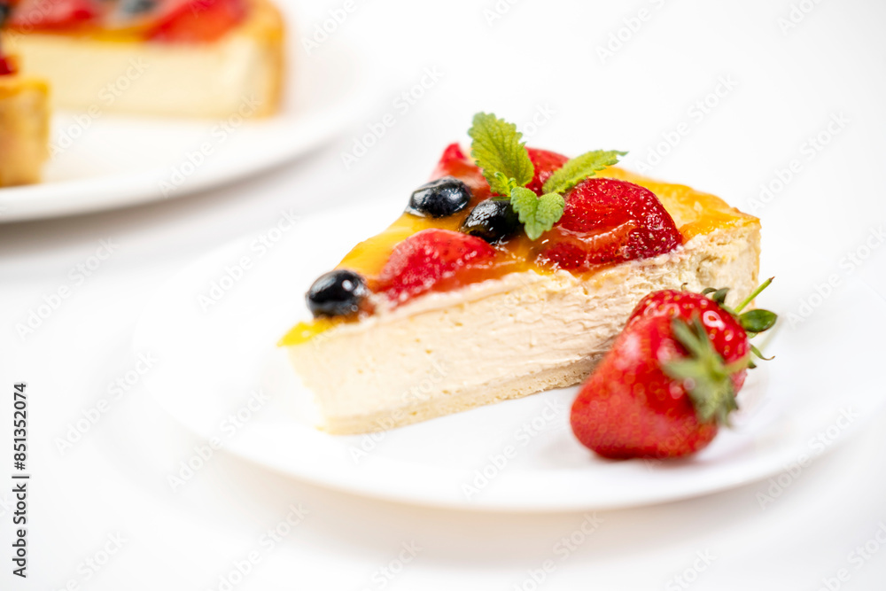 There's a slice of strawberry cheesecake on the plate. Menu for cafe, white background.
