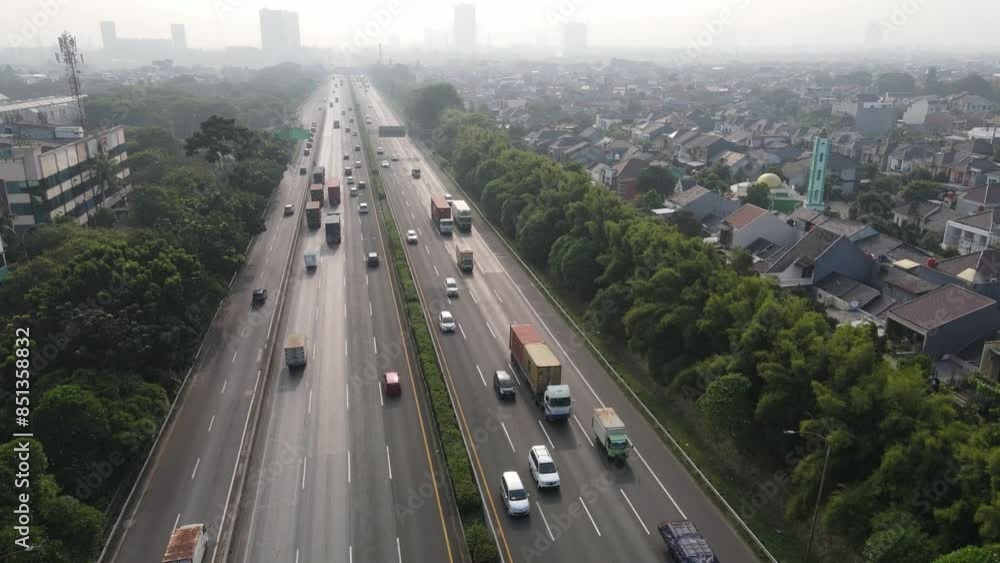 Traffic in the city from above. drone crosses the highway leading to housing Traffic in the city from above. drone crosses the highway leading to housing