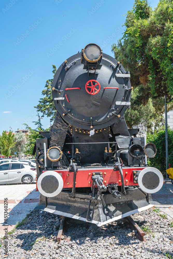 Obraz premium Steam locomotive in very bad condition, completely rusty and abandoned on the unused tracks at Uşak Rail way station.