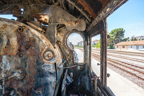 Steam locomotive in very bad condition, completely rusty and abandoned on the unused tracks at Uşak Rail way station. photo