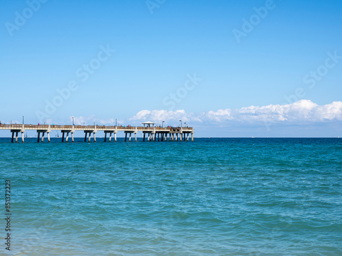 Dania Beach Pier in Fort Lauderdale, Florida is almost 1000 feet long, extending over the Atlantic Ocean.