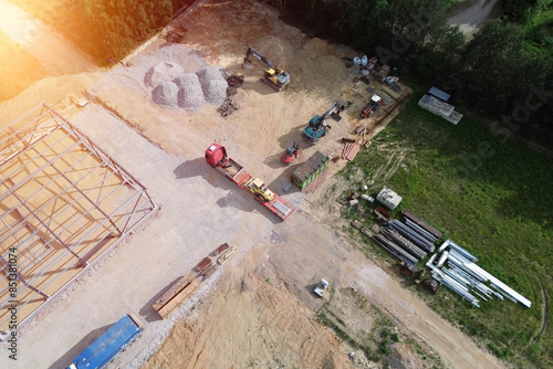 Machinery and excavator at civil engineering site aerial view