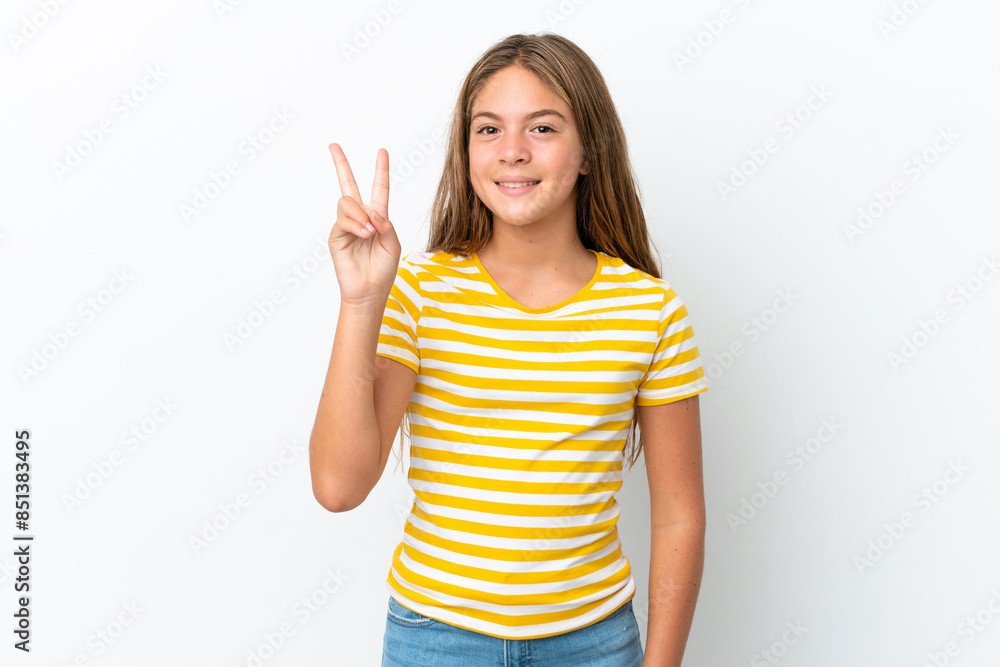 Little caucasian girl isolated on white background smiling and showing victory sign Little caucasian girl isolated on white background smiling and showing victory sign