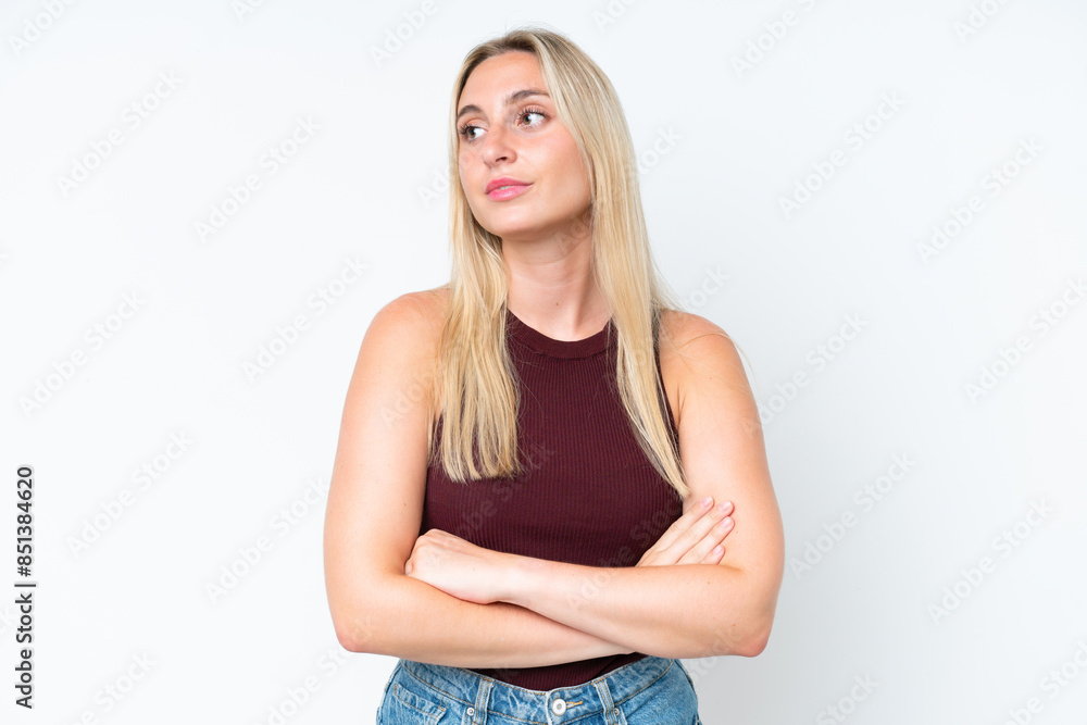 Young caucasian woman isolated on white background looking to the side Young caucasian woman isolated on white background looking to the side