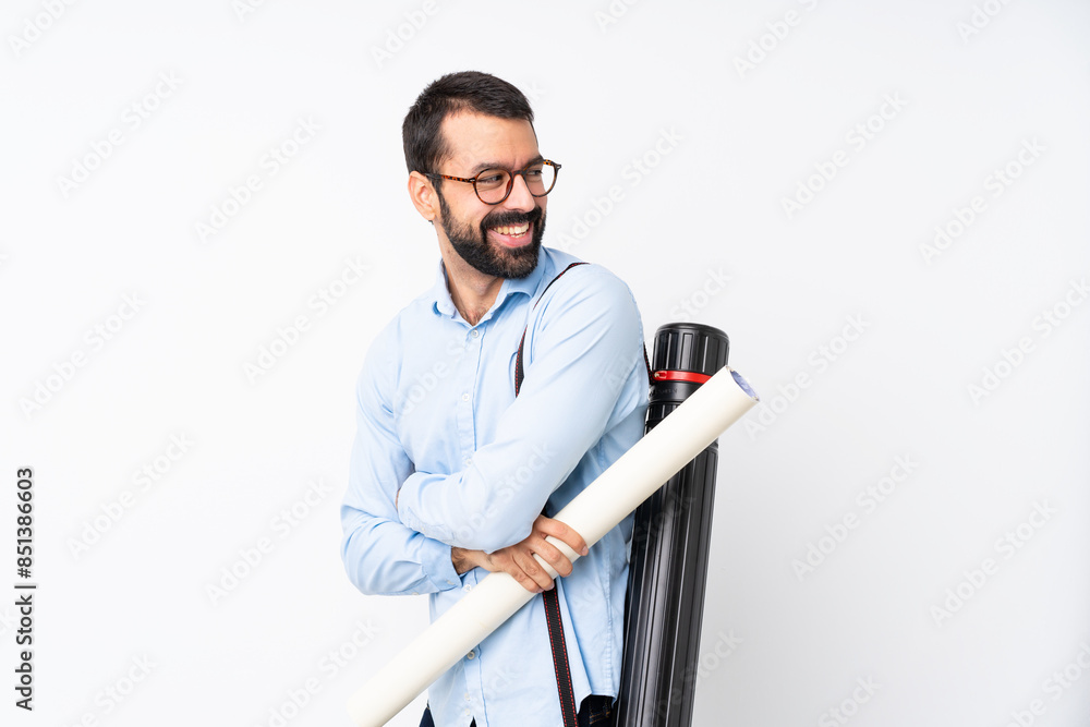 Young architect man with beard over isolated white background with arms crossed and happy Young architect man with beard over isolated white background with arms crossed and happy