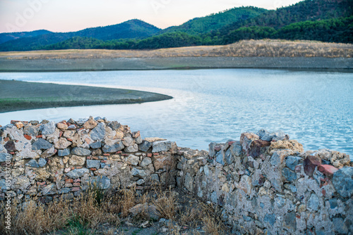 Historic House Emerging from Puente Nuevo Reservoir in Villaviciosa de Córdoba photo