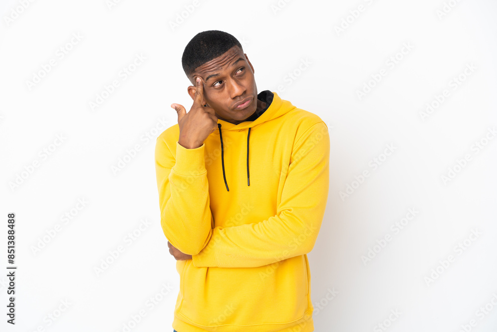 Young latin man isolated on white background with problems making suicide gesture Young latin man isolated on white background with problems making suicide gesture